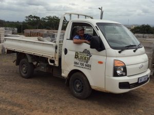 Comprehensive transport solutions featuring flatbed and tarped trucks for nationwide haulage.